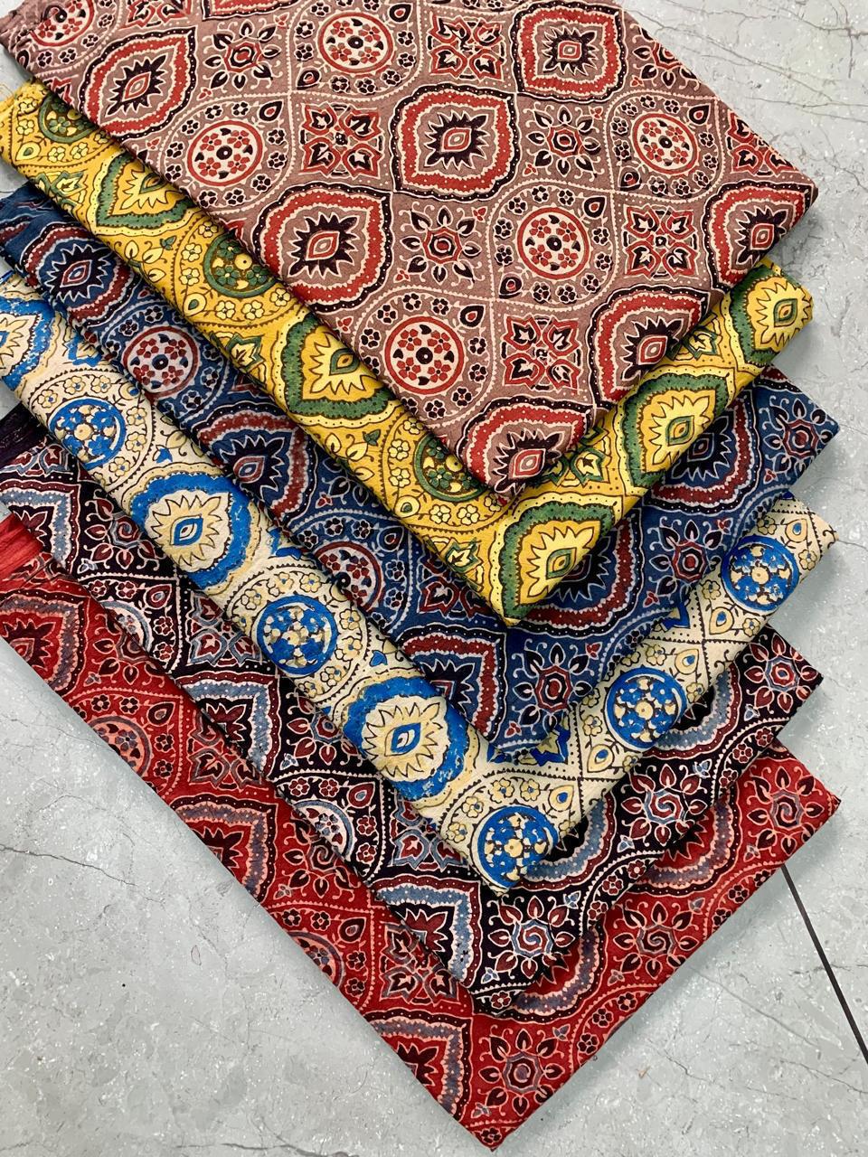 Cream multi-colour Ajrakh handblock printed pure cotton fabric featuring classic Rajasthan motifs for bulk purchase